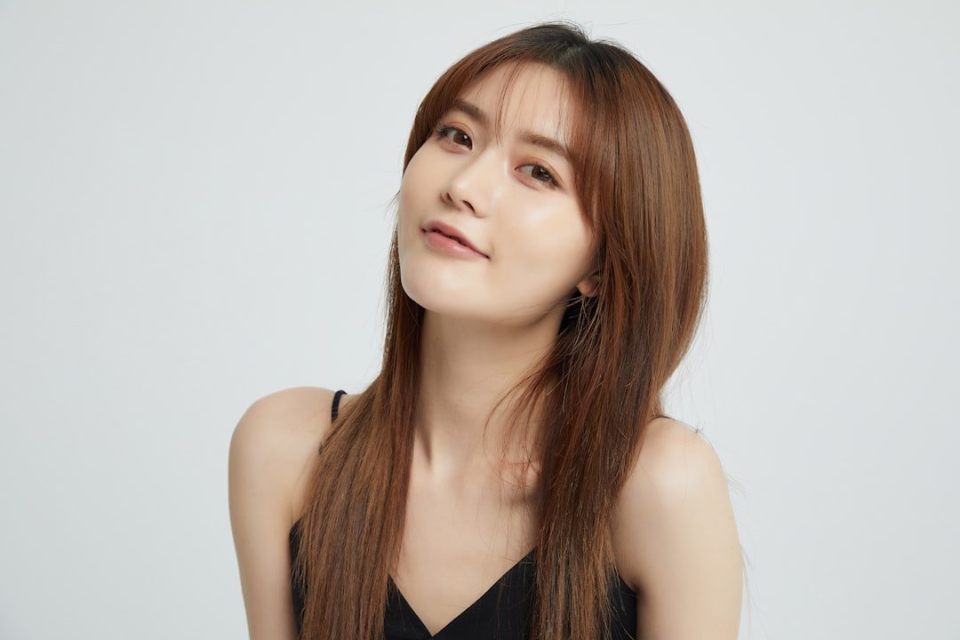 gallery-03 a-woman-with-long-hair-and-a-black-top-recx8fwyz24